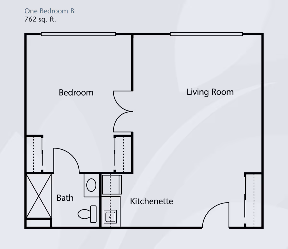 Floor plan labeled 'One Bedroom B 762 sq. ft.' showing a bedroom, living room, kitchenette, and bathroom layout.