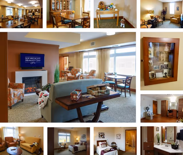 Collage of interior images from Ascension Living Lakeshore at Siena showing a living room with armchairs, a sofa, a fireplace with a TV above it displaying 'SHORELIGHT Memory Care', a dining area with tables and chairs, a small table with decorative items, a framed display of old photographs on the wall, a bedroom with a bed and seating, and a bathroom with a sink and mirror.