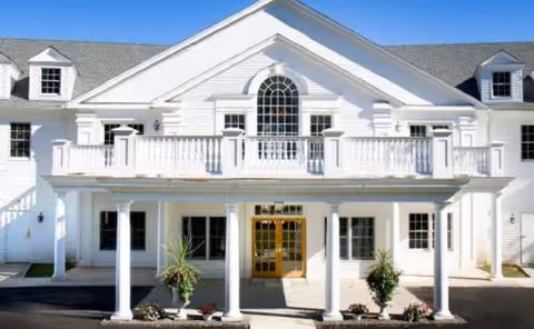 Commonwealth Senior Living at Haddam front exterior: white two-story building with a colonnaded entrance.