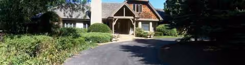 Front view of Theresa's Home Care I LLC facility with driveway and entrance.