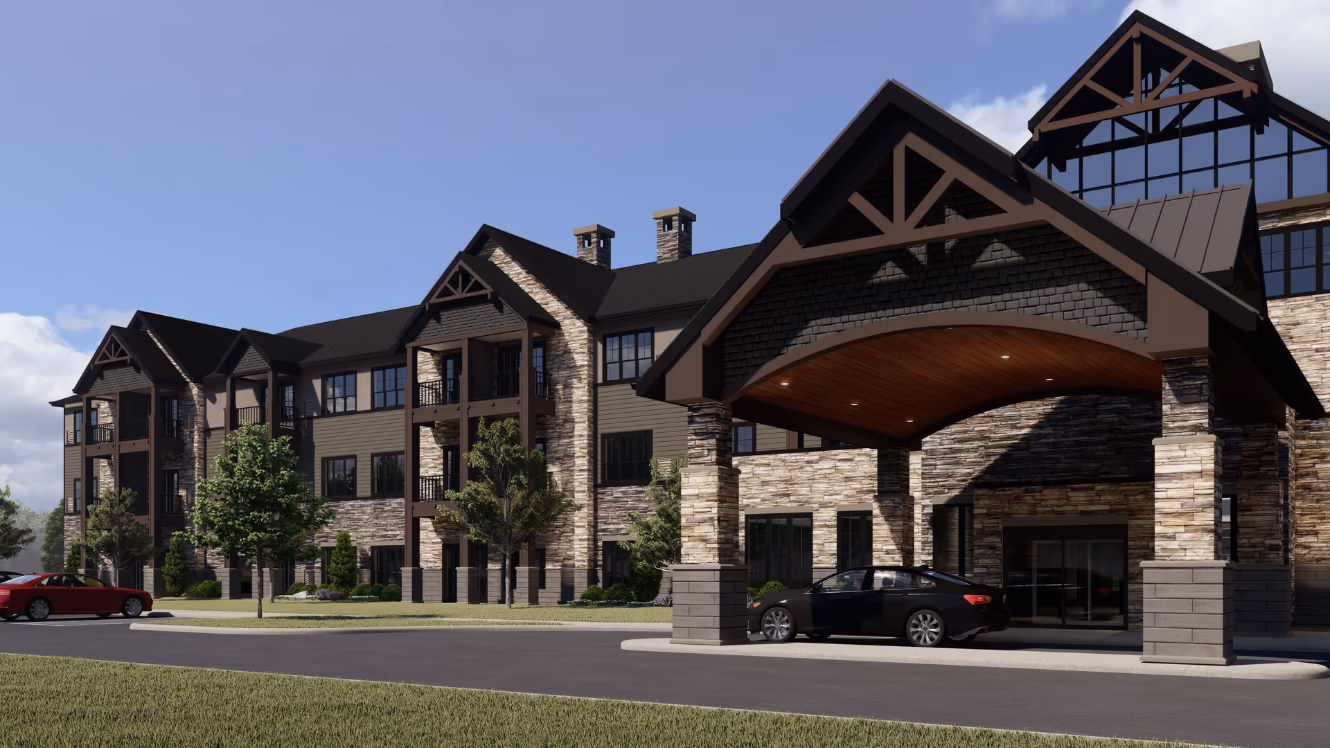 Front exterior of a multi-story senior living building with stone facade, covered porte-cochere entrance, and parked cars.