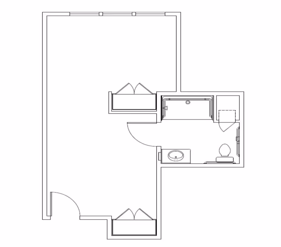 Architectural floor plan showing a room layout with a bathroom that includes a bathtub, toilet, and sink. The main room has two closets and an entry door.