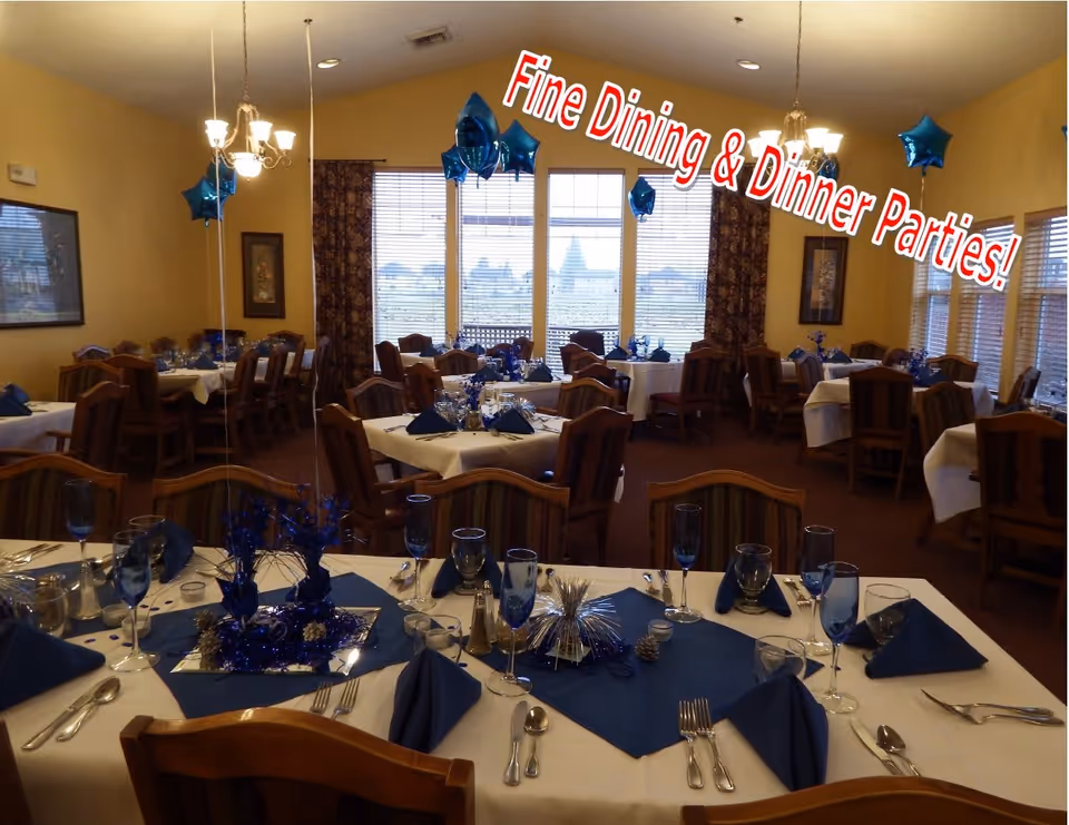 A dining room set up for a formal event with tables covered in white tablecloths and blue napkins, decorated with blue star-shaped balloons and centerpieces. The room has large windows with curtains and wooden chairs around the tables. Text on the image reads 'Fine Dining & Dinner Parties!'
