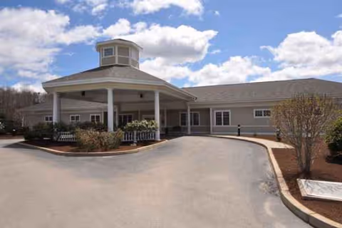 Exterior view of Nemasket Healthcare Center with a circular drive and covered front entrance.