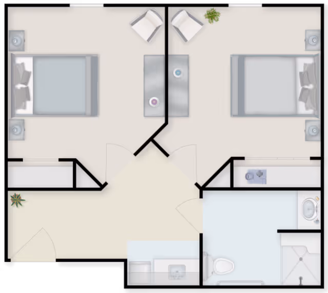 Top-down floor plan of a two-bedroom unit with a central living area, small kitchenette, and a bathroom.