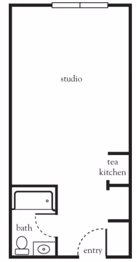 Floor plan of a studio apartment featuring an entry area, a tea kitchen, a bathroom with a toilet and sink, and a main studio living space.