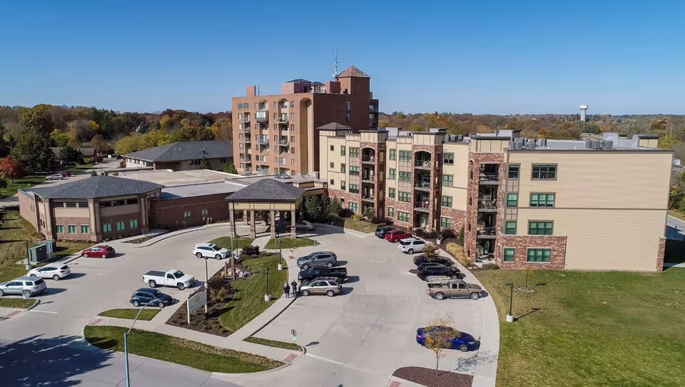 Aerial view of Green Hills Community campus with multiple buildings and parking.