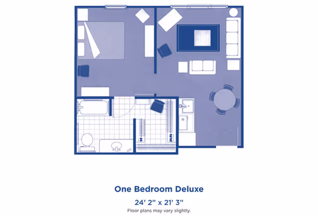 Floor plan of a one bedroom deluxe apartment showing a bedroom with a bed and nightstand, a living room with seating and a coffee table, a kitchen area with a sink and dining table, and a bathroom with a bathtub, toilet, and sink.
