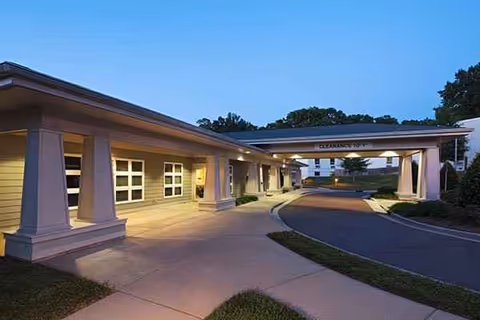 Exterior view of a Senior Resource Center entrance with a covered drop-off canopy.