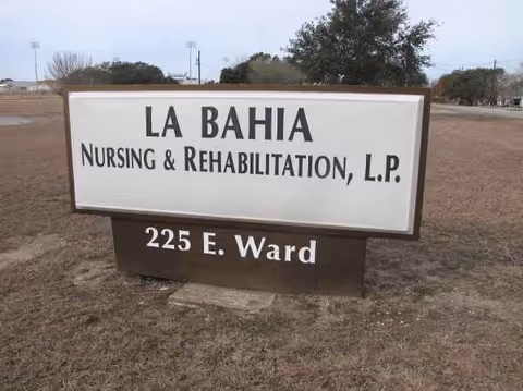 A large outdoor sign reads LA BAHIA Nursing and Rehabilitation, 225 E. Ward.