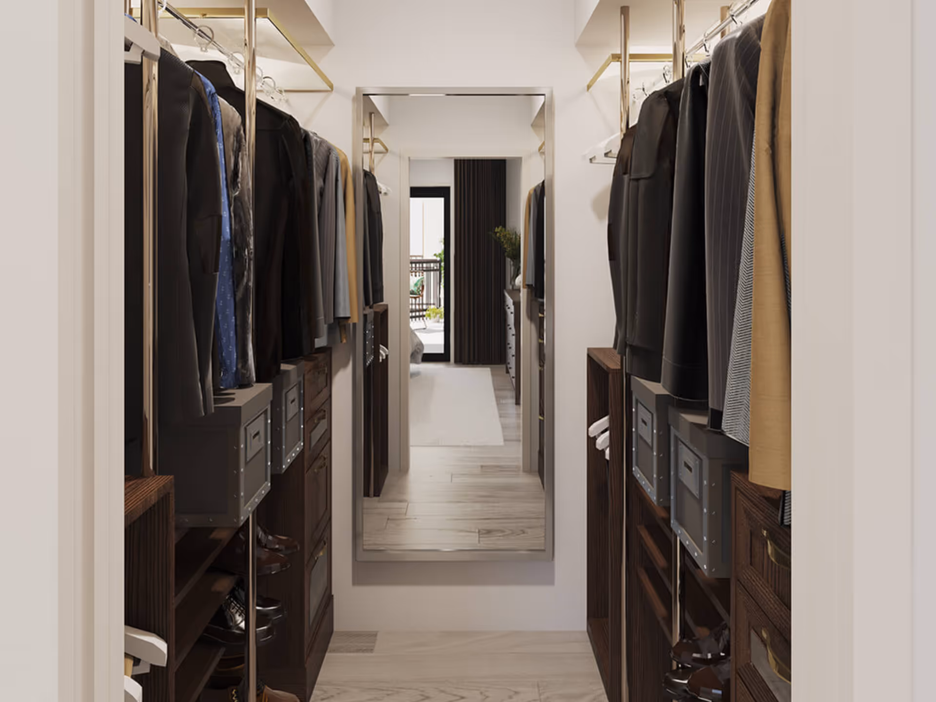 A narrow walk-in closet with hanging clothes on both sides, dark wooden shelves and drawers, and a large mirror at the end reflecting a bedroom and balcony area.