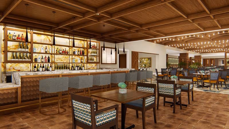 Spacious modern dining area with a marble-topped bar, bar stools, and multiple dining tables under a wooden coffered ceiling.
