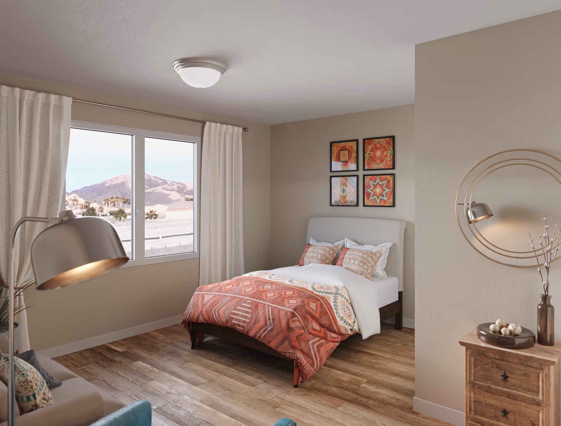 A cozy bedroom with a bed featuring a patterned red and beige blanket and matching pillows. The room has wooden flooring, a window with white curtains showing a mountain view outside, a round mirror on the wall, a wooden nightstand with decorative items, and a floor lamp next to a sofa.