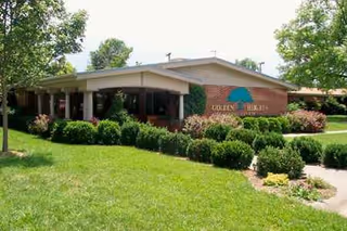 Front exterior of Parkview Heights Care Center with a covered entrance and manicured landscaping.