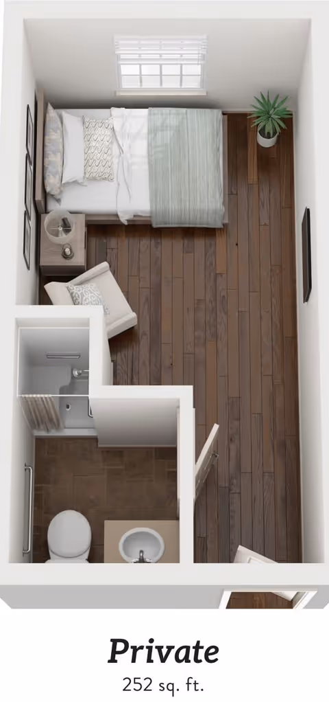Top-down view of a small private living space with a bed, nightstand with lamp, armchair, potted plant, and a bathroom with a toilet, sink, and shower. The room has wooden flooring and a window above the bed.