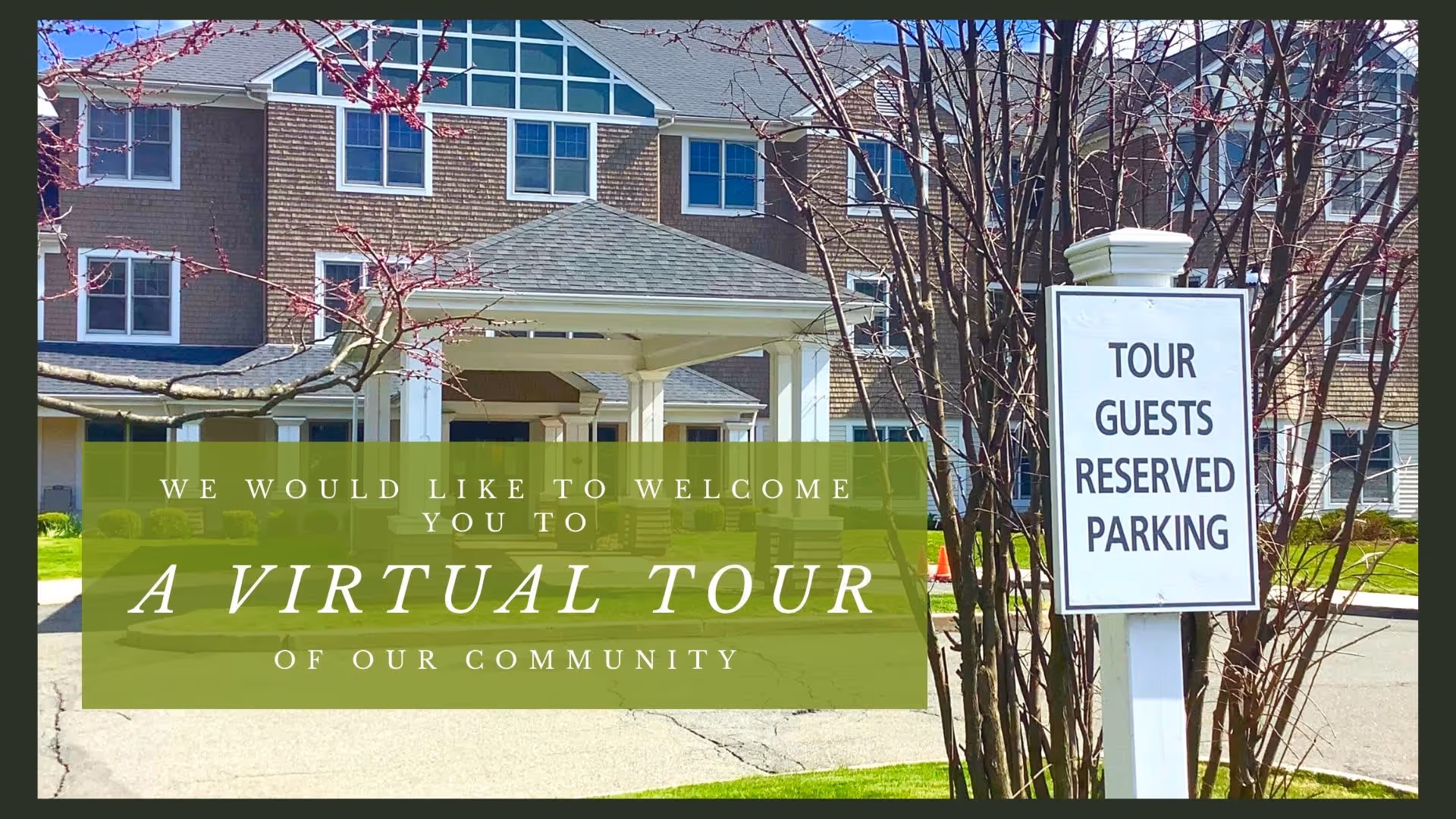 Exterior view of a senior living facility building with a covered entrance and multiple windows. In the foreground, there is a sign that reads 'TOUR GUESTS RESERVED PARKING' and some leafless trees. Overlaid text on the image says, 'We would like to welcome you to a virtual tour of our community.'