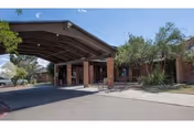 Exterior view of Focused Care at Fort Stockton entrance with brick facade and covered driveway.