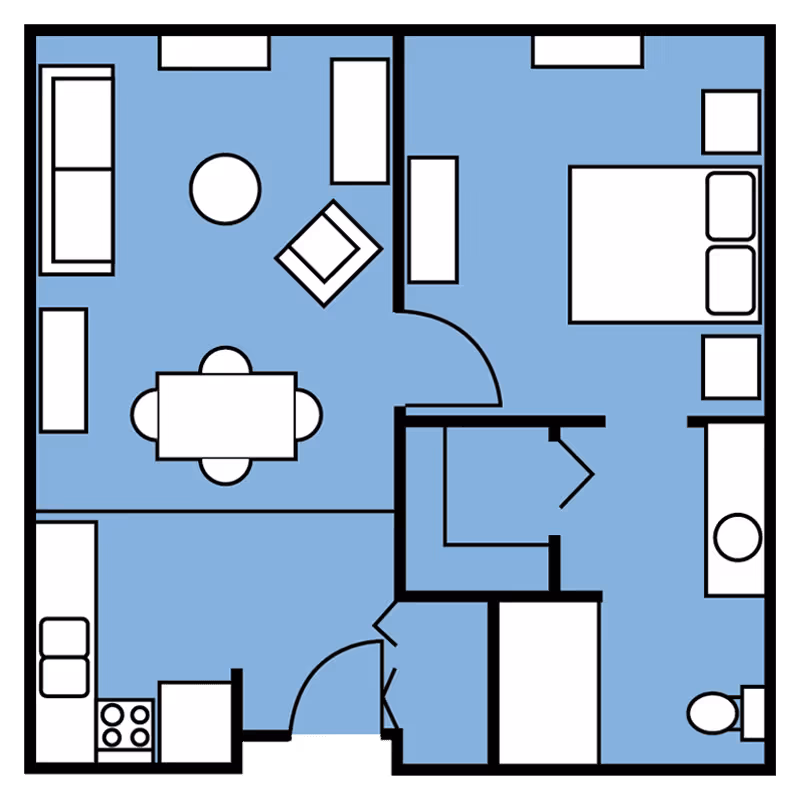 Floor plan of a one-bedroom apartment showing a living room with sofa, armchair, coffee table, and dining table, a kitchen with stove and sink, a bedroom with a bed and nightstands, and a bathroom with a toilet and sink.