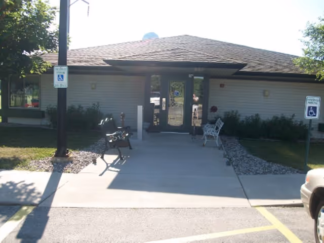 Front entrance of Garrow-Villa CBRF with benches and accessible signage.