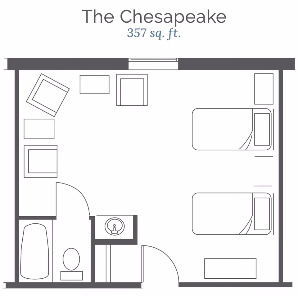 Floor plan of The Chesapeake unit showing a 357 square feet layout with two beds, a seating area with chairs and tables, a bathroom with a bathtub and toilet, and a small sink area.