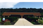 Front exterior view of Susquehanna Valley Nursing and Rehab Center with entrance pathway.