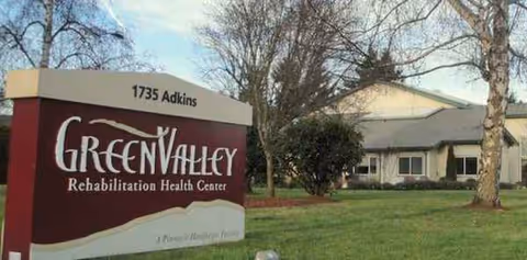 Front view of Green Valley Rehabilitation Health Center sign and building.