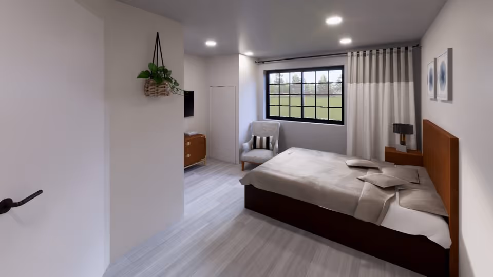 A modern bedroom with a large bed covered in beige bedding, a cushioned armchair with a striped pillow near a window with black grid frames, light gray flooring, a wooden nightstand with a lamp, two framed artworks on the wall, and a hanging plant on a white wall near the door.