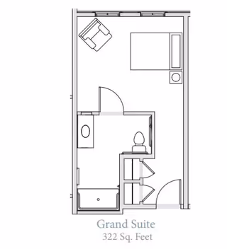 Floor plan of a Grand Suite measuring 322 square feet, showing a layout with a bed, chair, bathroom with toilet and sink, and a shower area.