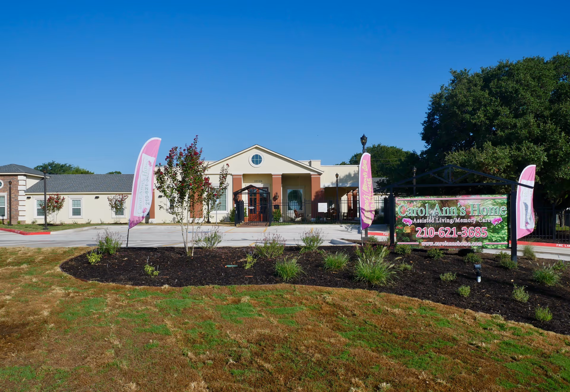 Exterior view of Carol Ann's Home facility with entrance, signage, and landscaping.