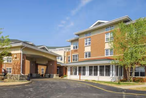 Exterior view of Trustwell Living at Eagle Pointe Place entrance.