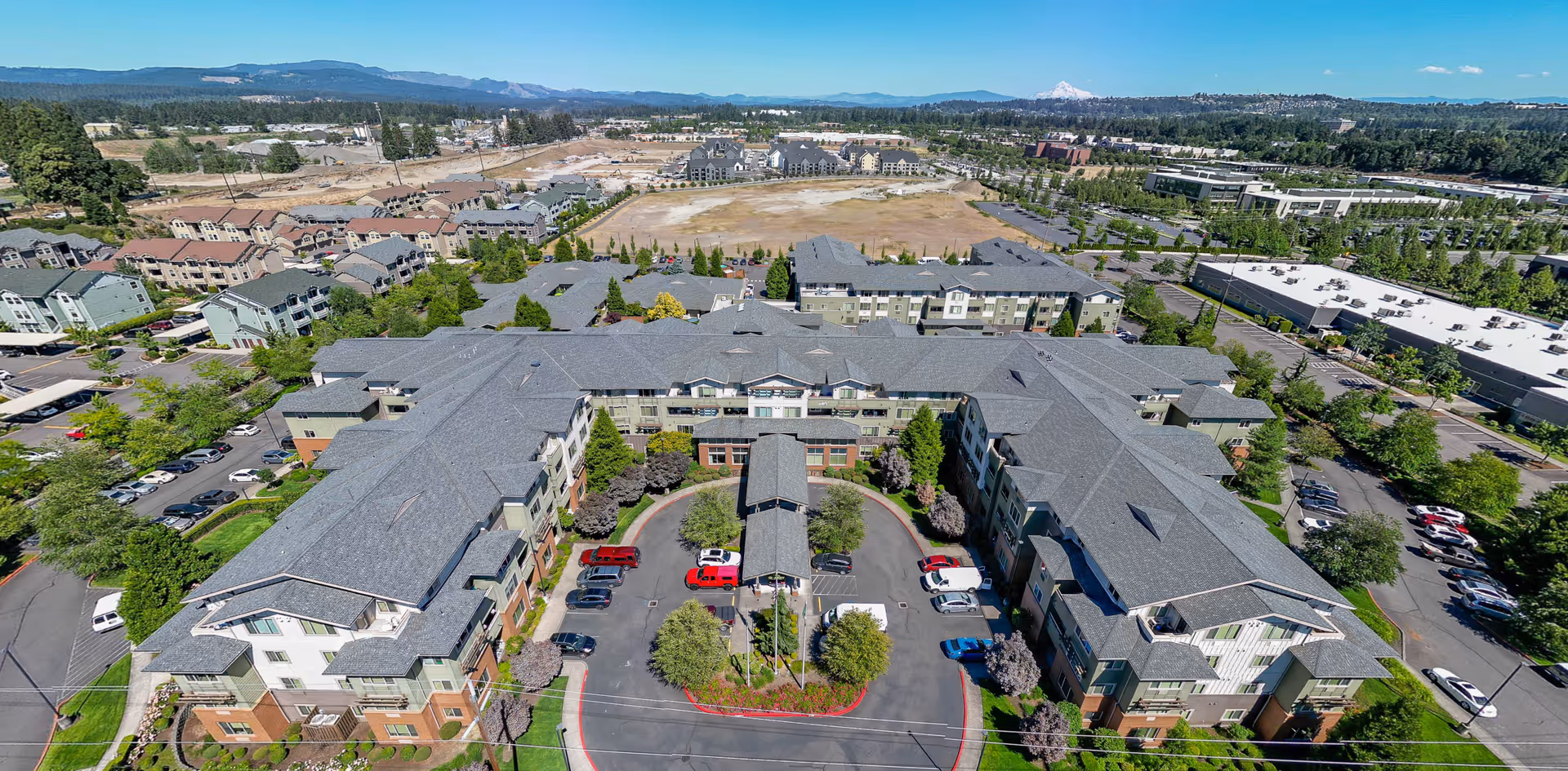 Aerial view of Cogir at The Quarry senior living complex with a circular drive