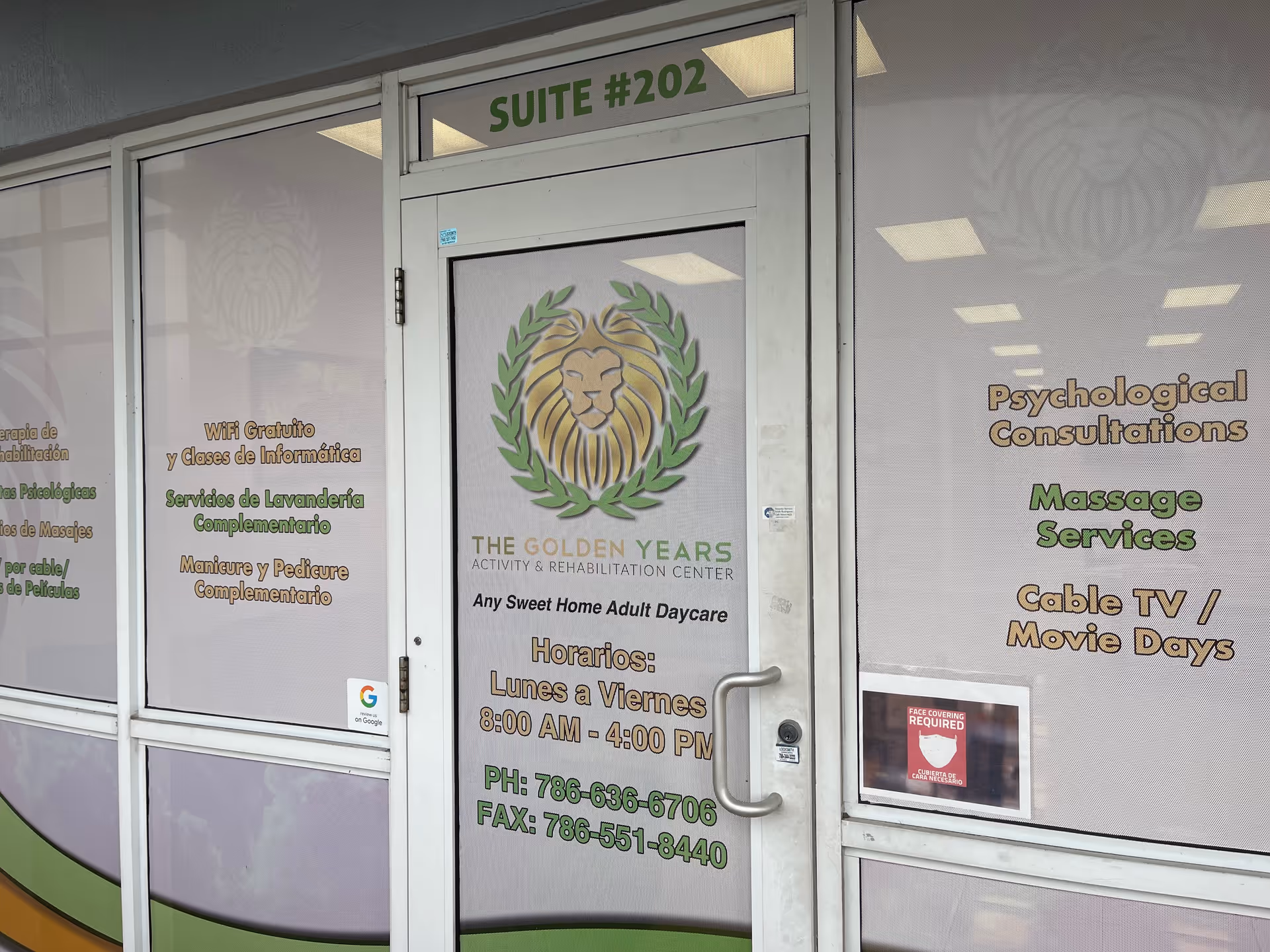 Entrance door and windows of THE GOLDEN YEARS Activity & Rehabilitation Center suite #202, displaying services offered such as psychological consultations, massage services, cable TV/movie days, free WiFi, computer classes, laundry services, and manicure/pedicure. The door also shows operating hours Monday to Friday from 8:00 AM to 4:00 PM, along with phone and fax numbers.
