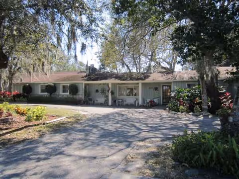 Front view of Countryside Haven senior living facility, single-story with driveway and landscaped surroundings.