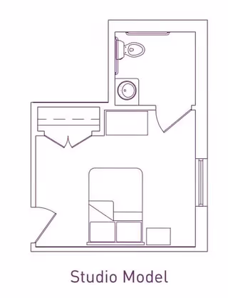 Architectural floor plan of a studio model apartment showing a combined living and sleeping area with a bed, a small closet, a bathroom with a toilet and sink, and an entry door.