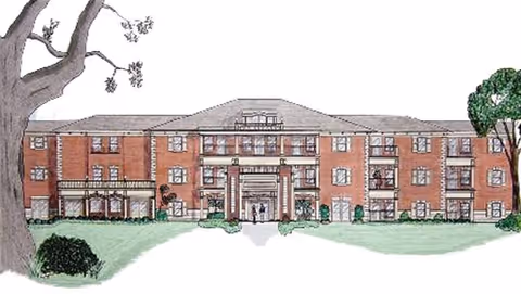 Illustration of the front exterior of a three-story brick senior living community building with a central entrance, windows, and some trees and shrubs in the foreground.