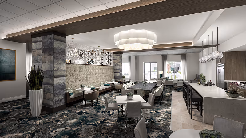 Spacious modern communal dining and lounge area with tables, banquette seating, a long bar counter, and decorative lighting.