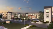 Exterior view of a modern senior living facility named Cadence Broomfield during dusk, showing a well-lit entrance, multiple parked cars, and landscaped surroundings with a clear sky.