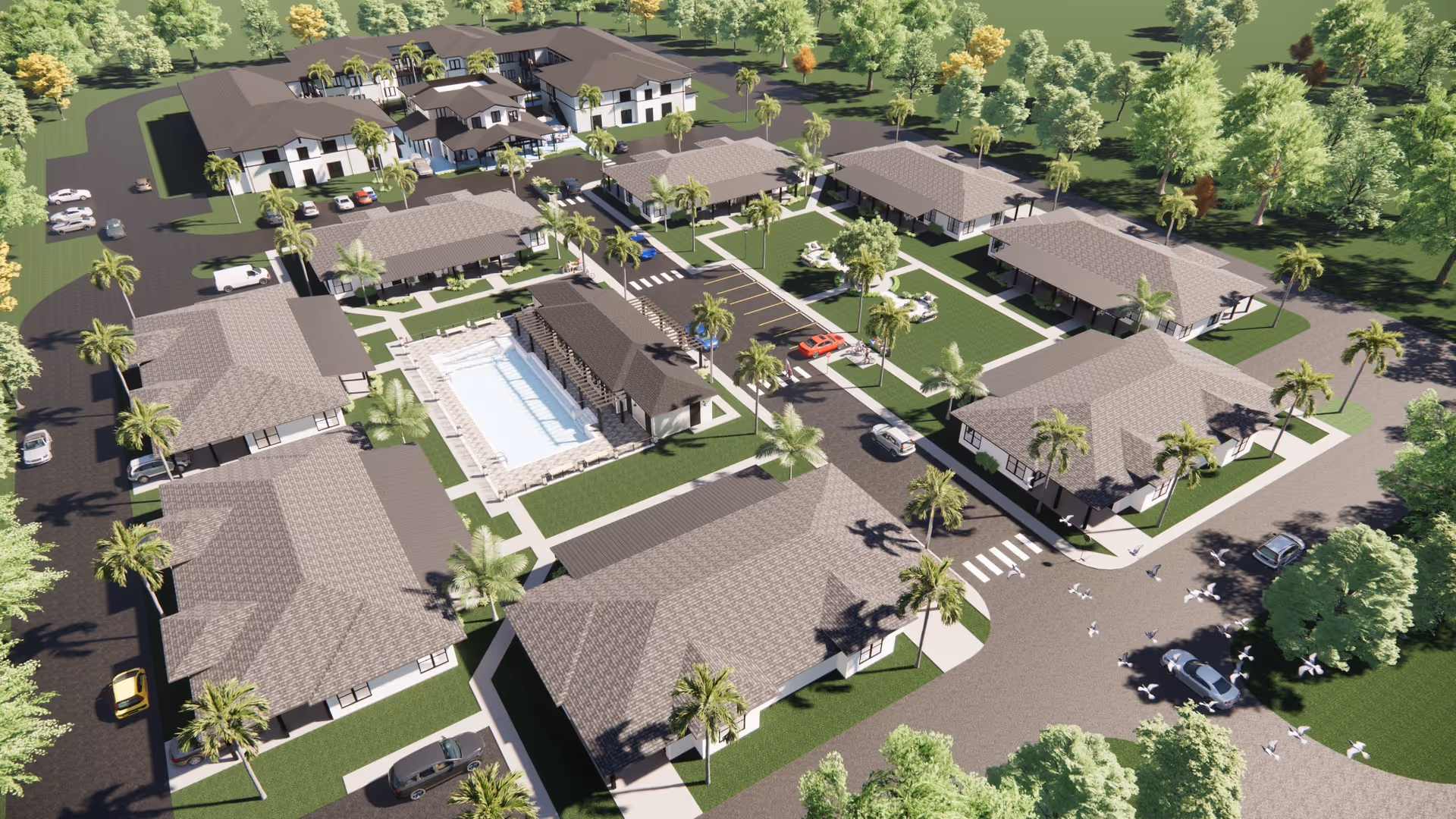 Aerial view of a senior living facility featuring multiple single-story buildings with brown roofs arranged around a central swimming pool. The area is landscaped with palm trees, green lawns, and parking spaces with several cars parked. Surrounding the facility are dense green trees.