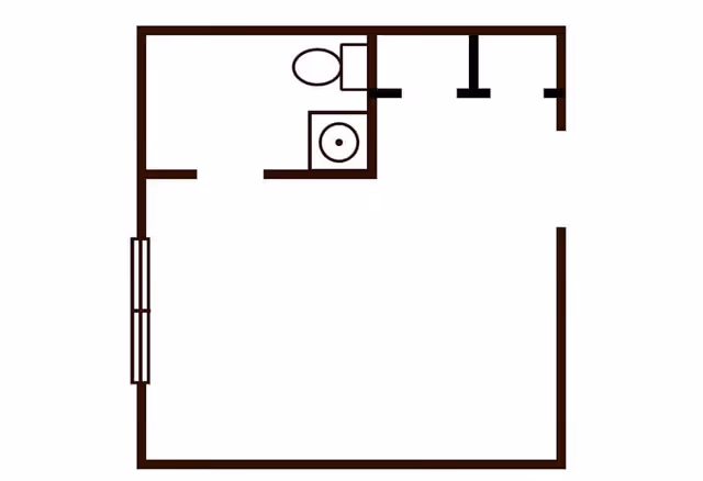 Simple architectural floor plan showing a small room with a bathroom that includes a toilet and a sink.