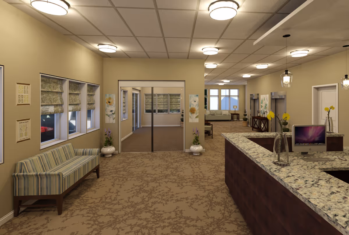 Interior view of the lobby at Providence Place Senior Living at the Collegeville Inn, featuring a reception desk, seating area, and decorative plants.