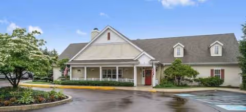 Exterior view of Brookdale Dublin senior living facility with a covered entrance and landscaping.