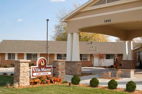 Exterior view of Villa Manor Care Center with sign and welcoming entrance.