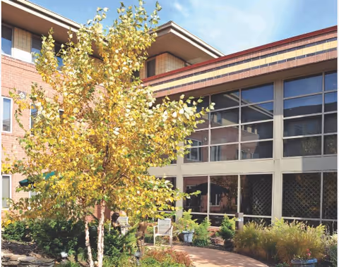 Daughters of Miriam Center for Nursing and Rehabilitation building exterior with large windows and landscaped grounds.