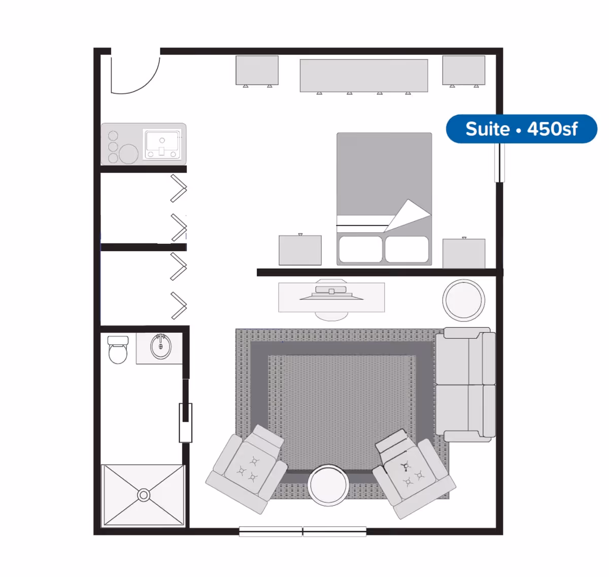 Floor plan of a 450 square foot suite at Pines of Newmarket, showing a combined living and bedroom area with a bed, nightstands, sofa, two armchairs, a round table, and a TV stand. The suite also includes a kitchenette with a sink and stove, a bathroom with a toilet, sink, and shower, and closet spaces.