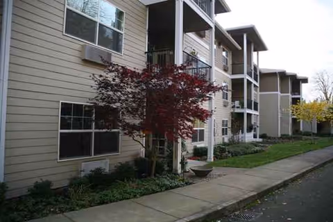 Exterior view of Olympic Place by Bonaventure, a multi-story residential building with balconies.
