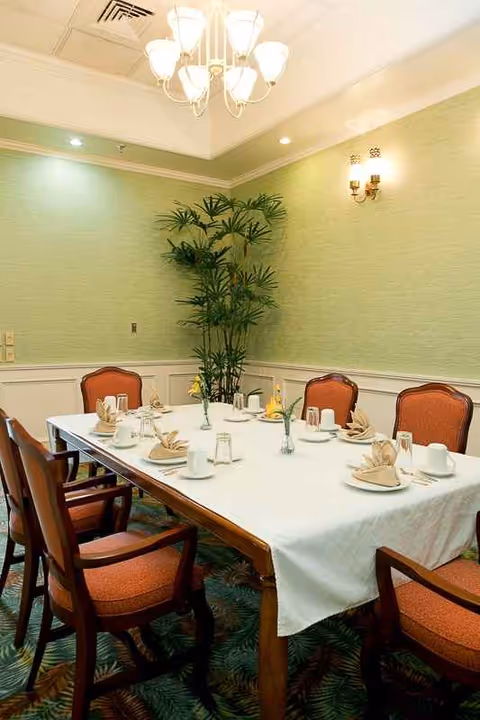Dining room in Hale Anuenue Restorative Care with a table set for a meal.
