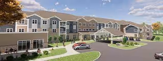 Front exterior of a large senior living facility with a covered entrance, driveway, parked cars, and landscaped grounds.