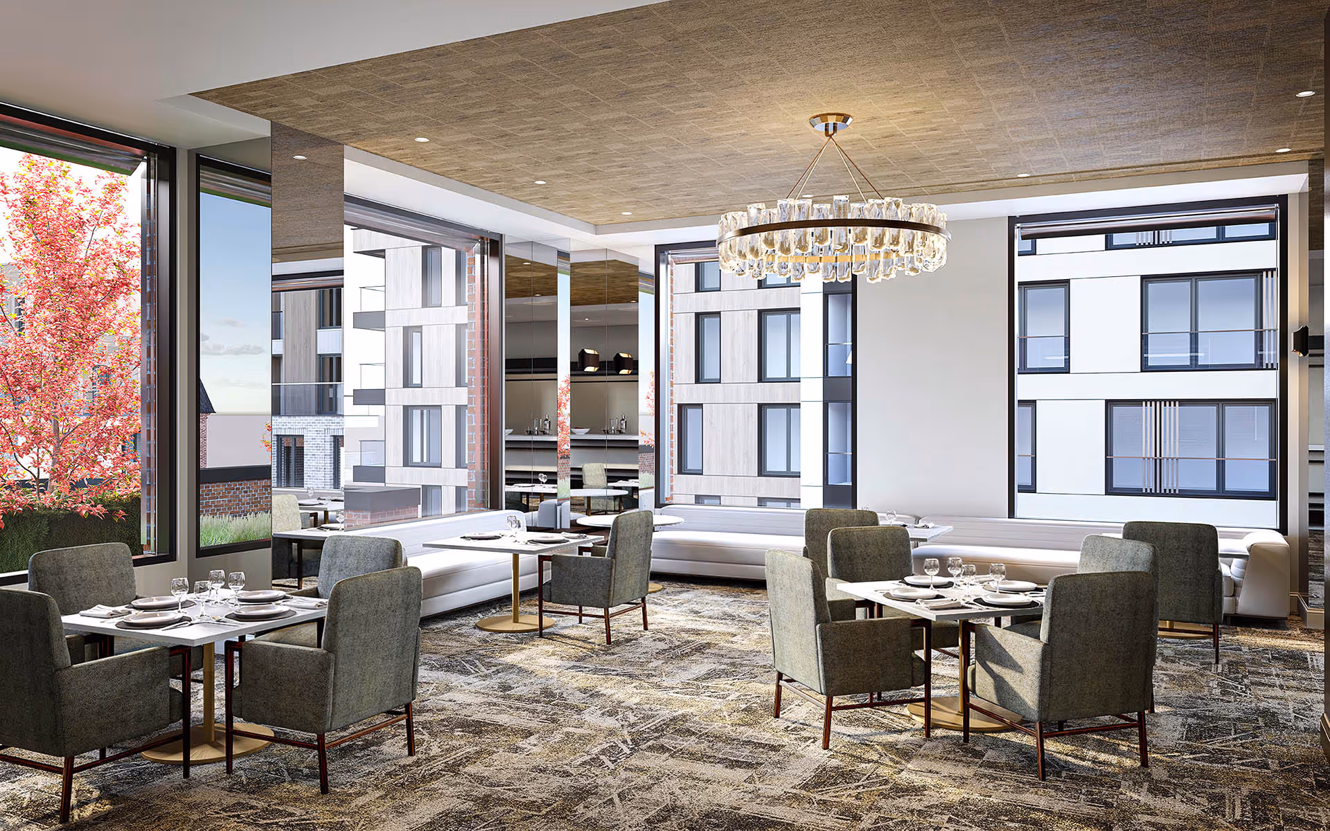 Dining/lounge area with multiple set tables and upholstered chairs, large windows, and a crystal chandelier.