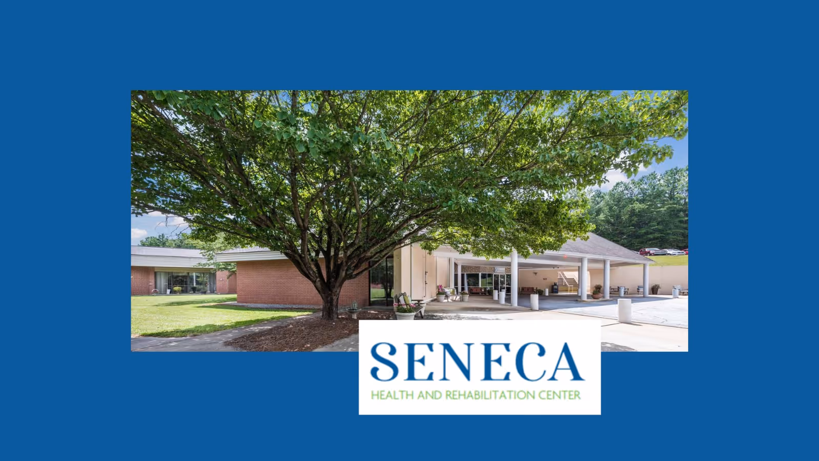 Exterior view of Seneca Health and Rehabilitation Center showing a large tree in front of a brick building with a covered entrance and a driveway.