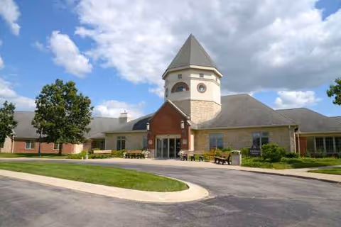 Exterior view of Springfield Masonic Community building with driveway and tower entry